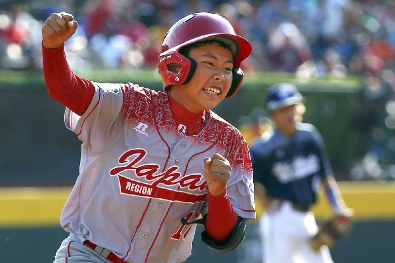 Japan’s Masafuji Nishijima rounds third after hitting a three-run home run in the third inning of the Little League World Series final in South Williamsport, Pa., on Sunday.