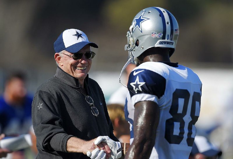 Dallas Cowboys owner Jerry Jones is shown talking with wide receiver Dez Bryant in Oxnard, Calif., in this Aug. 18 file photo. 