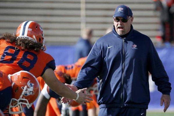 UTEP head coach Sean Kugler, right, shakes hands with Augie Touris (88) prior to the New Mexico Bowl NCAA college football game against Utah State Saturday, Dec. 20, 2014, in Albuquerque, N.M. (AP Photo/Ross D. Franklin)