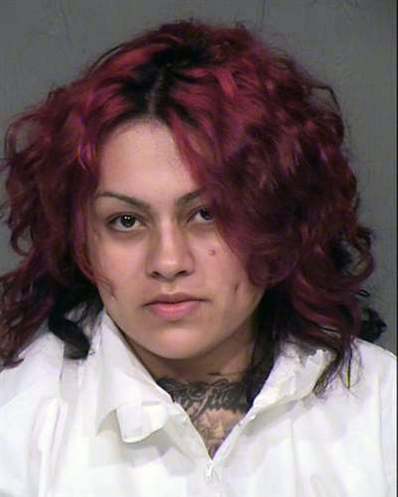 This undated booking photo provided by the Maricopa County sheriff shows Mireya Alejandra Lopez, who was arrested Sunday, Aug. 30, 2015 at a home in Avondale, Ariz. 
