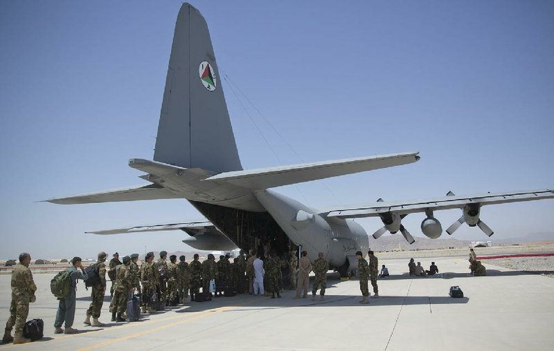 Afghan National Army soldiers board a C-130 Hercules on Aug. 18 at Kandahar Air Base in Kandahar, Afghanistan.