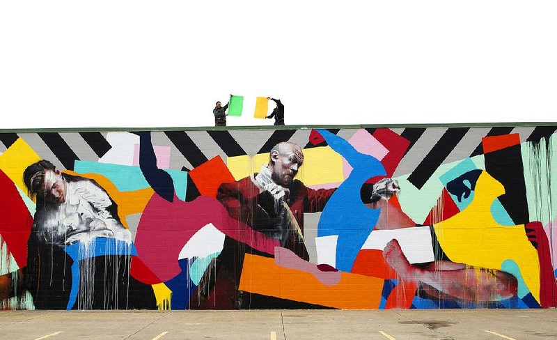 Irish artists Maser and Conor Harrington collaborated on the mural on the wall of Fort Smith’s Boardertown Skate Shop.
