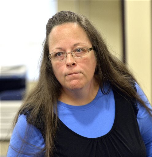 Rowan County Clerk Kim Davis listens to a customer after her office's refusal to issue marriage licenses at the Rowan County Courthouse in Morehead, Ky., on Tuesday, Sept. 1, 2015.