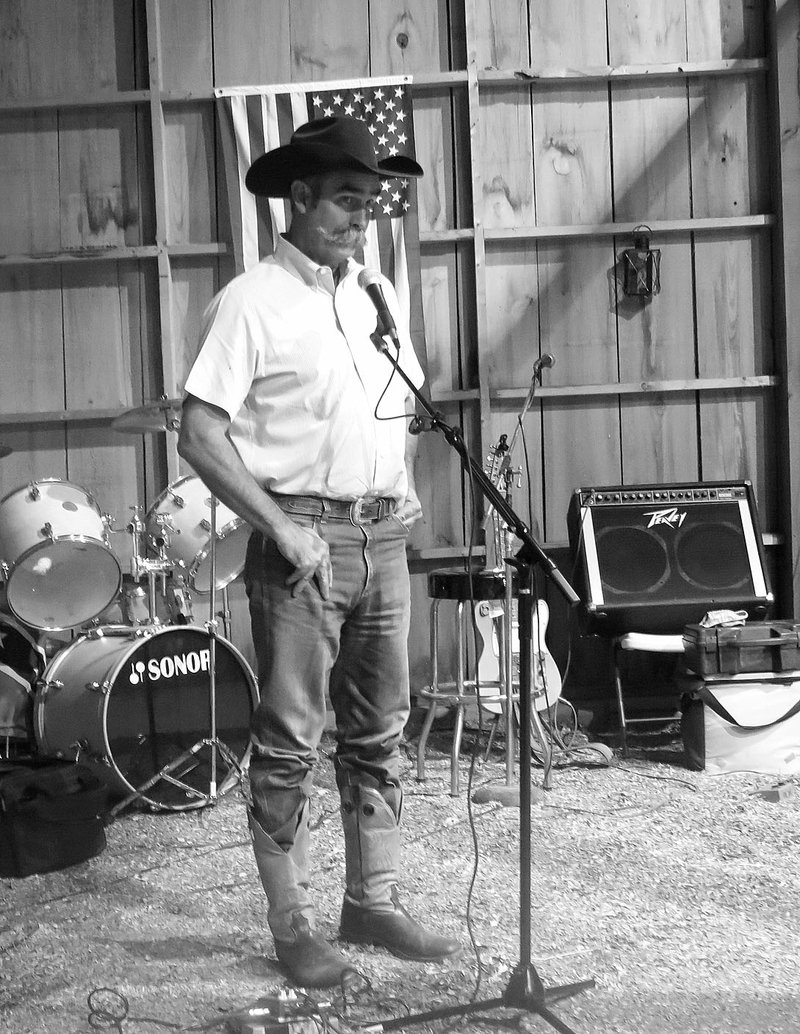 Photo by Susan Holland Cowboy poet Ron McDaniel, of Sulphur Springs, recited two of his poems for the guests at the Gravette Library gala Saturday evening. One of his works took first place honors for humorous poem in national competition at Abilene, Kansas, recently.