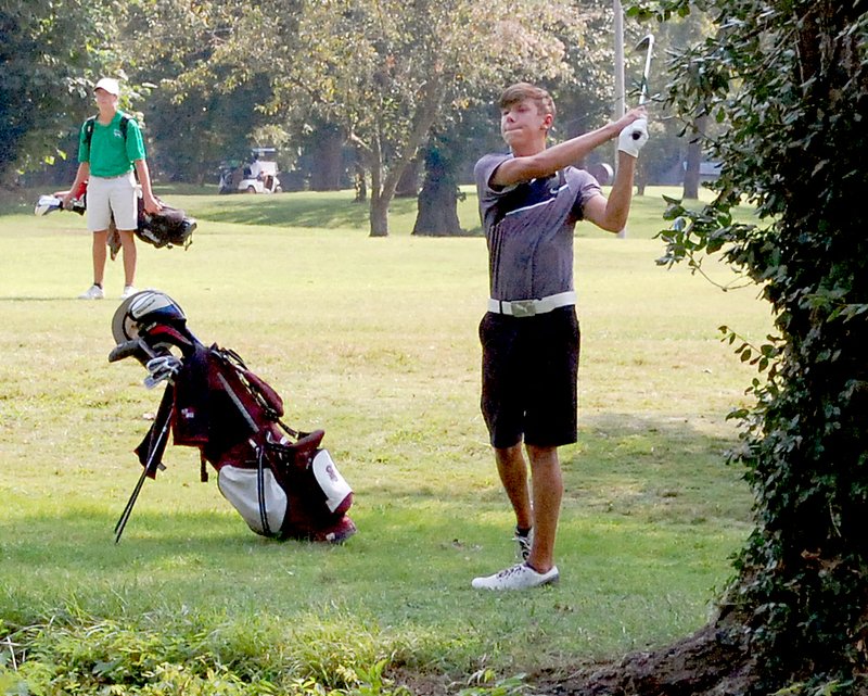 Graham Thomas/Herald-Leader Siloam Springs senior golfer Aaron Jones watches his second shot on hole No. 1 Monday at Siloam Springs Country Club. Jones earned medalist honors after shooting 32 in the nine-hole match.