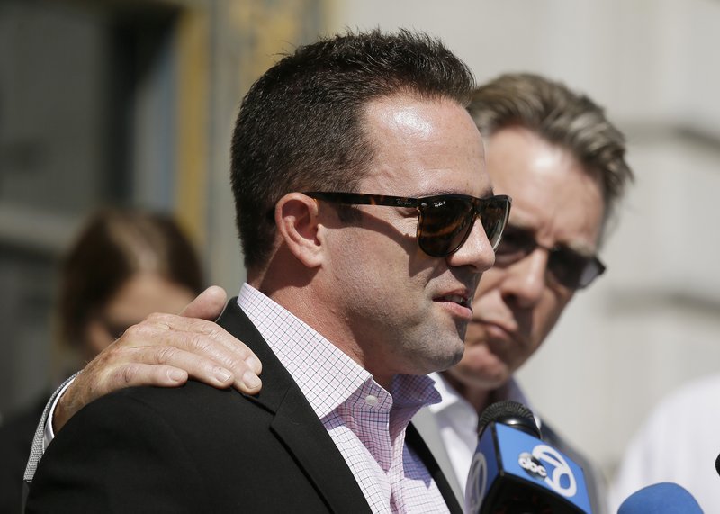 Brad Steinle, left, and Jim Steinle, right, the brother and father of Kathryn Steinle, answer questions during a news conference on the steps of City Hall Tuesday, Sept. 1, 2015, in San Francisco.