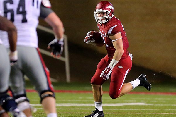 Arkansas linebacker Brooks Ellis returns an interception during the fourth quarter of a game against Ole Miss on Saturday, Nov. 22, 2015, at Razorback Stadium in Fayetteville. 