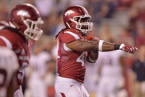 Arkansas linebacker Josh Williams prepares for a play during a game against Northern Illinois on Saturday, Sept. 20, 2014, at Razorback Stadium in Fayetteville. 