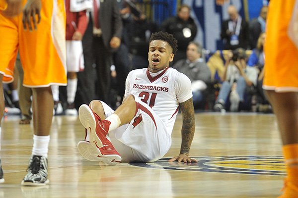 Arkansas guard Anton Beard reacts after being knocked to the floor during an SEC Tournament game against Tennessee on Friday, March 13, 2015, in Nashville, Tenn. 