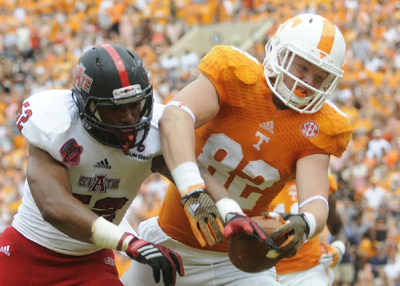 Arkansas State’s Quanterio Heath (left), shown last season against Tennessee, will be the Red Wolves’ only linebacker with playing experience entering Saturday’s season opener against Southern Cal.