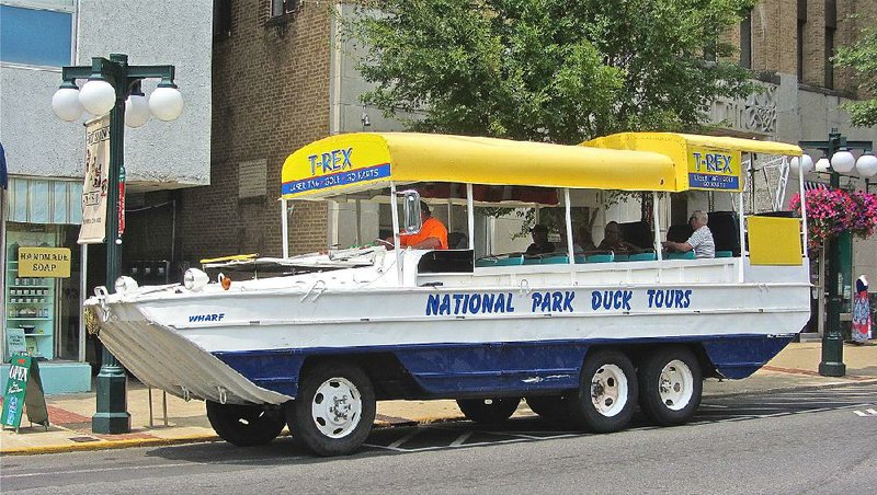 National Park Duck Tours board passengers on Central Avenue across from Bathhouse Row in Hot Springs. 