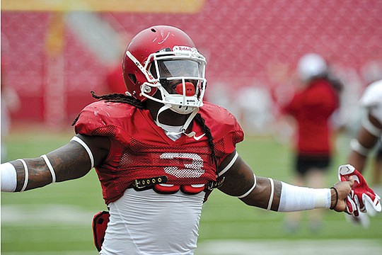 NWA Democrat-Gazette/Michael Woods JUNIOR’S CLASS: Junior Alex Collins, coming off a 1,000-yard rushing season, takes on increased responsibility for the Arkansas Razorbacks following the season-ending injury to senior Jonathan Williams in preseason. Arkansas’ season opener is 2:30 p.m. Saturday against Texas-El Paso at Reynolds Razorback Stadium in Fayetteville.