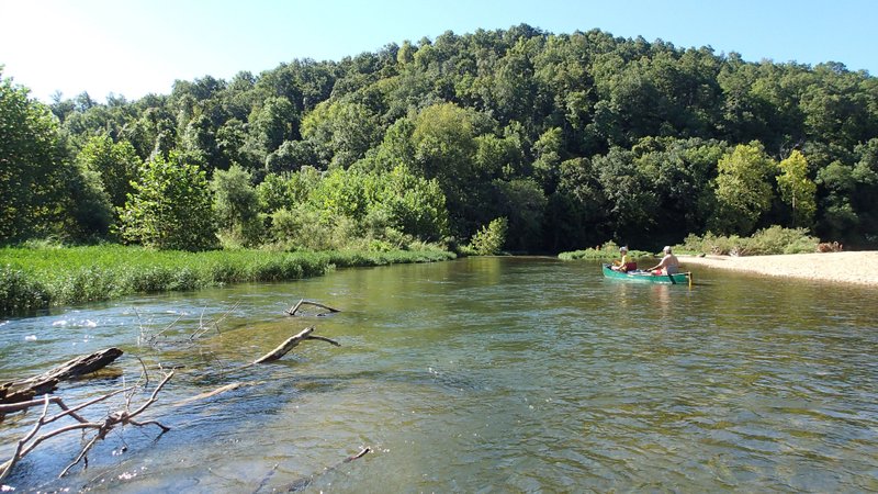 NWA Democrat-Gazette/FLIP PUTTHOFF Big Sugar Creek near Pineville, Mo., offers superb floating and fishing. Grimley Graham (left) and Bob Ross drift Aug. 20 down the stream during a 3.5-mile float.