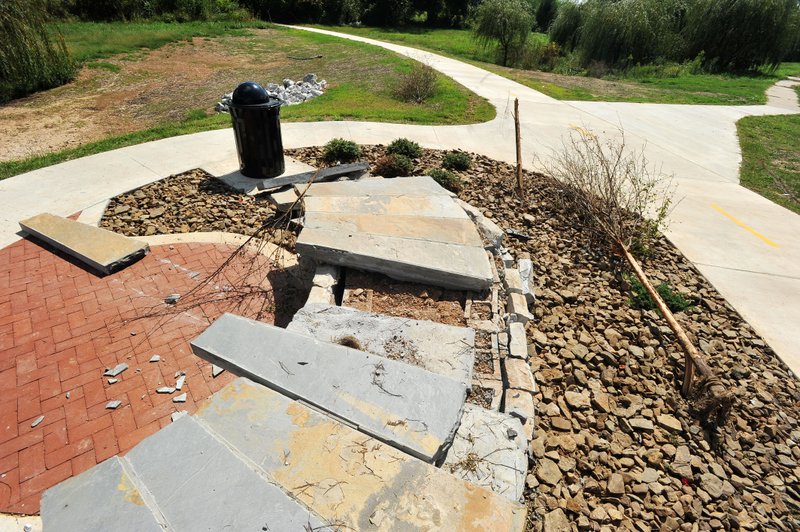 NWA Democrat-Gazette/MICHAEL WOODS &#8226; @NWAMICHAELW A single-car accident caused about $11,000 damage to this resting stop on a trail along West Oliver Drive in Rogers. City officials will have to take money out of reserve to fix the damage.