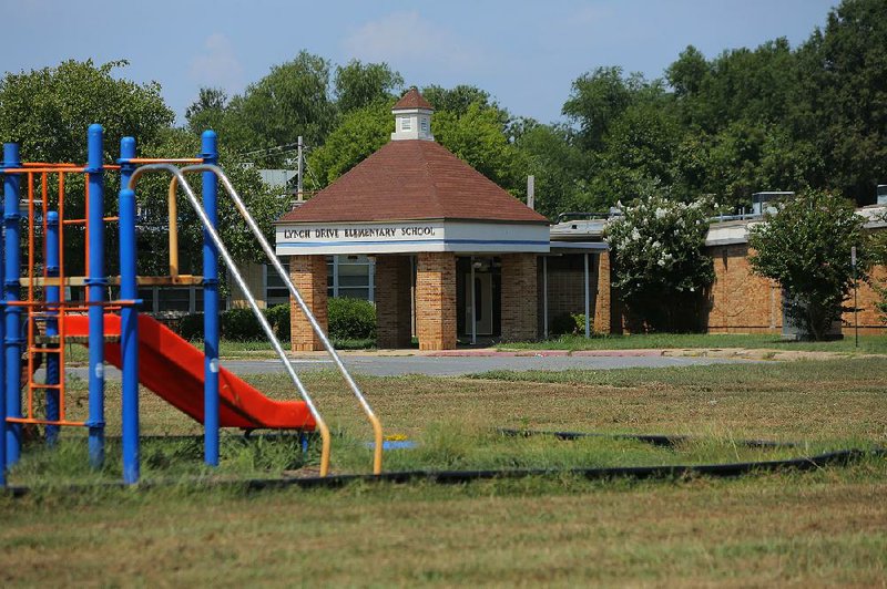 Vandalism at the shuttered Lynch Drive Elementary School in North Little Rock has thrown a wrench into the sale of several properties.