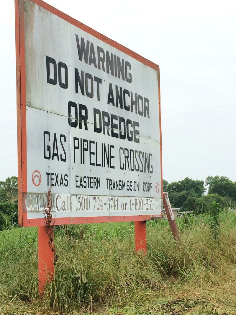 A sign marks the location of Spectra Energy’s Texas Eastern natural gas pipeline in east Little Rock near the Arkansas River. 