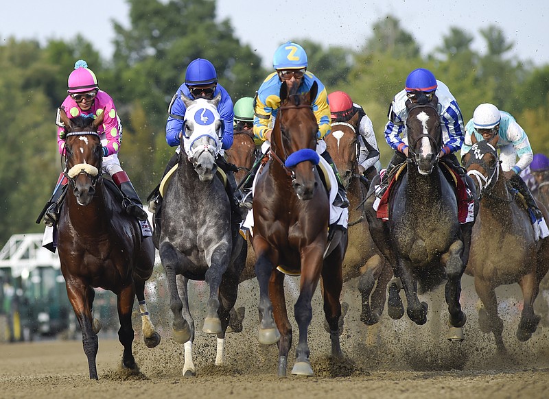 The Associated Press BRED TO RUN: American Pharoah, center, with jockey Victor Espinoza up, leads the field into the first turn during the Travers Saturday at Saratoga Race Course in Saratoga Springs, N.Y. The owner of American Pharoah says the Triple Crown winner will run again in the Breeders' Cup Classic before he is retired at the end of the year. Ahmed Zayat tweeted Thursday he has "decided to continue to race American Pharoah! The champ deserves another chance!"