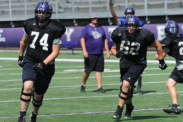 Nick Chickillo (74), Fayetteville senior offensive lineman, practices Wednesday, Sept. 2, 2015, at Harmon Stadium in Fayetteville. Chickillo has overcome injury and the loss of his mother to become a leader for the Dogs offensive line.