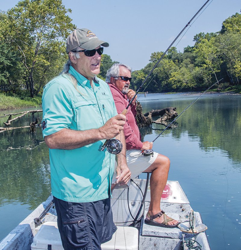 David Mitchell, left, and Lowell Myers fish on the Little Red River outside Heber Springs. As fall approaches, new precautions must be taken when fishing along the river. Proper procedures for the upcoming fall fishing season are taught by local fishing guides in and around Heber Springs.