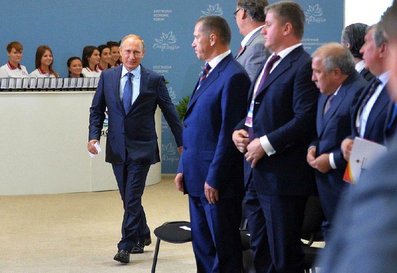 Russian President Vladimir Putin arrives at the opening Friday of the East Economic Forum in Vladivostok, Russia. 