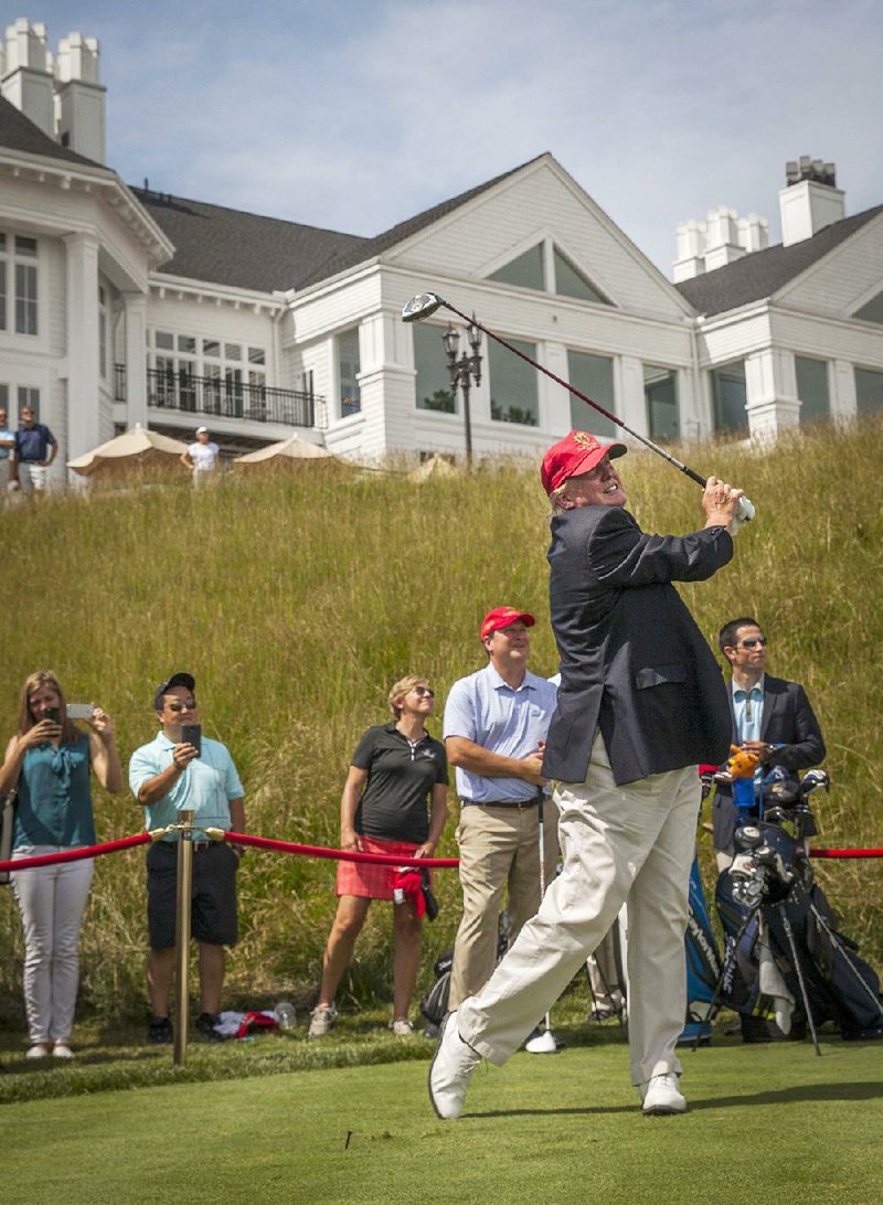 Donald Trump shows his form at the opening of a golf club he owns in Sterling, Va., in June. “I’ve played a lot, and I’ve played well,” Trump said. “There’s very few people that can beat me in golf.” 