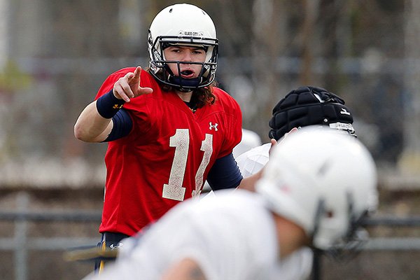 Toledo quarterback Logan Woodside (11) and directs his teammates during NCAA college football practice, Thursday, Jan. 1, 2015, in Mobile, Ala.