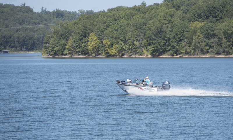 Boaters, such as this one Wednesday on Beaver Lake, are subject to a new state law that makes driving a boat while intoxicated an offense as serious as driving a vehicle while intoxicated. 