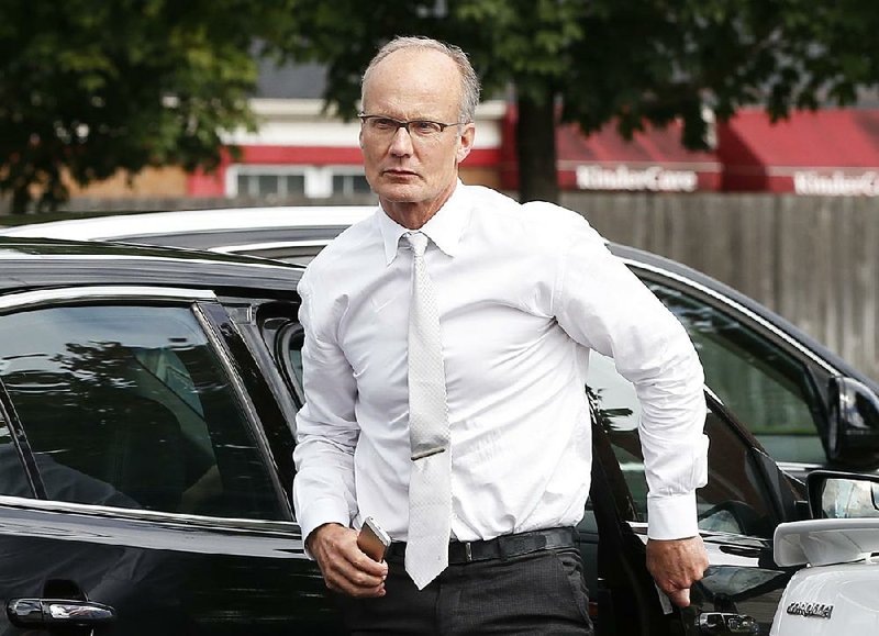 Dentist Walter Palmer, who returned to his practice, Tuesday, Sept. 8, 2015, in Bloomington, Minn., arrives back to his office following a lunch break. 