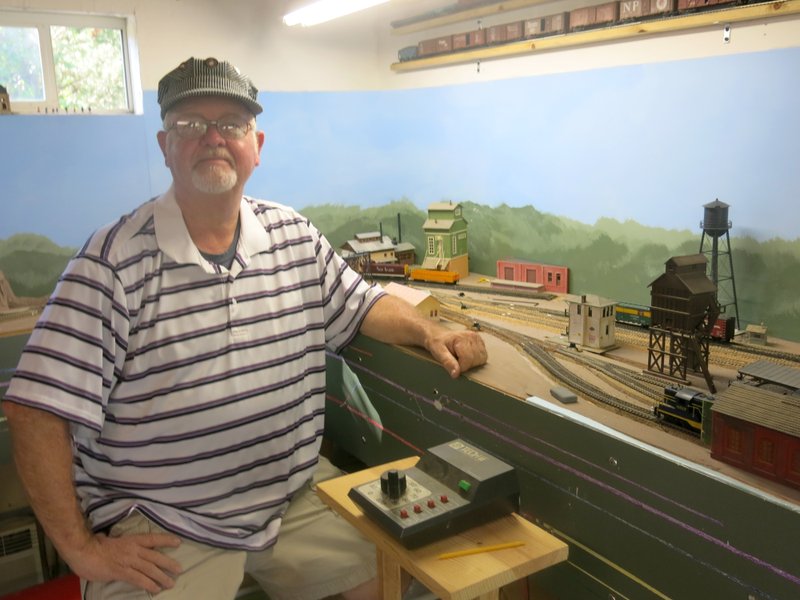 Photo by Susan Holland Al Blair, one of the newest members of the Gravette Museum Commission, is an avid model railroader. He joined the commission this spring and helped with the museum&#8217;s &#8220;Living on the Railroad&#8221; model train exhibit on Gravette Day. He will be continuing to help with restoring the buildings and scenery on the Gravette diorama and refurbishing the Old Town Park section of the layout.