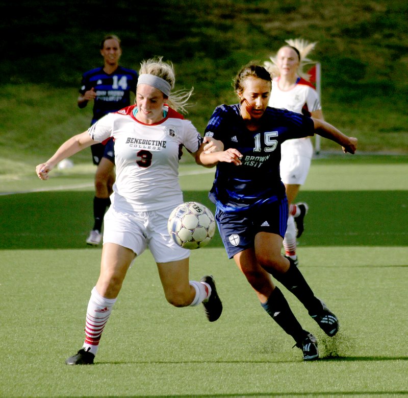 Photo courtesy of JBU Sports Information John Brown University senior Alex Fahr, right, battles with Benedictine College&#8217;s Anna Romano in JBU&#8217;s 5-2 loss last Saturday. JBU returns to action on Thursday against No. 15 Grace (Ind.) at 5:30 p.m. at Alumni Field.