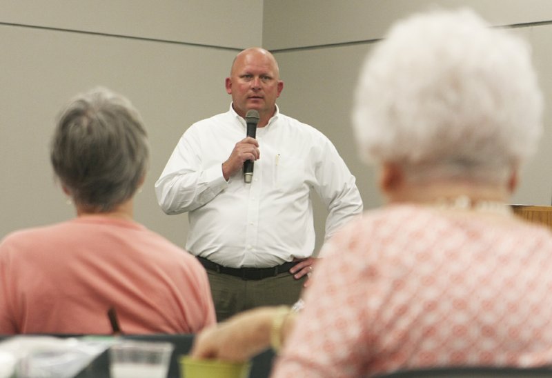 NWA Democrat-Gazette/AMYE BUCKLEY Rogers Police Chief Hayes Minor runs down of crime statistics in Rogers for the fall start of the Rogers Public Library&#8217;s Lunch and Learn program Tuesday at the libary. &#8220;There is very, very little random violent crime in the city of Rogers,&#8221; he said.