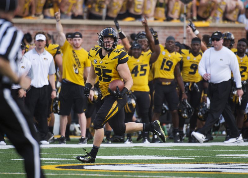 In this Sept. 5, 2015, file photo, Missouri's Tyler Hunt runs toward the end zone as he scores on a 78-yard reception during the fourth quarter of an NCAA college football game against Southeast Missouri State in Columbia, Mo. 