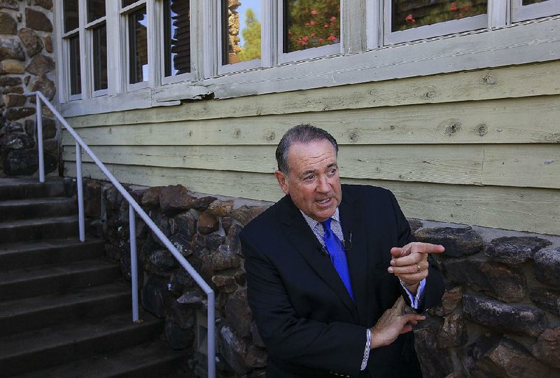 Former Gov. Mike Huckabee, speaking to reporters outside the Conway Country Club before a fundraiser Thursday, said the recent U.S. Supreme Court decision on same-sex marriage was “unconstitutional overreach.”