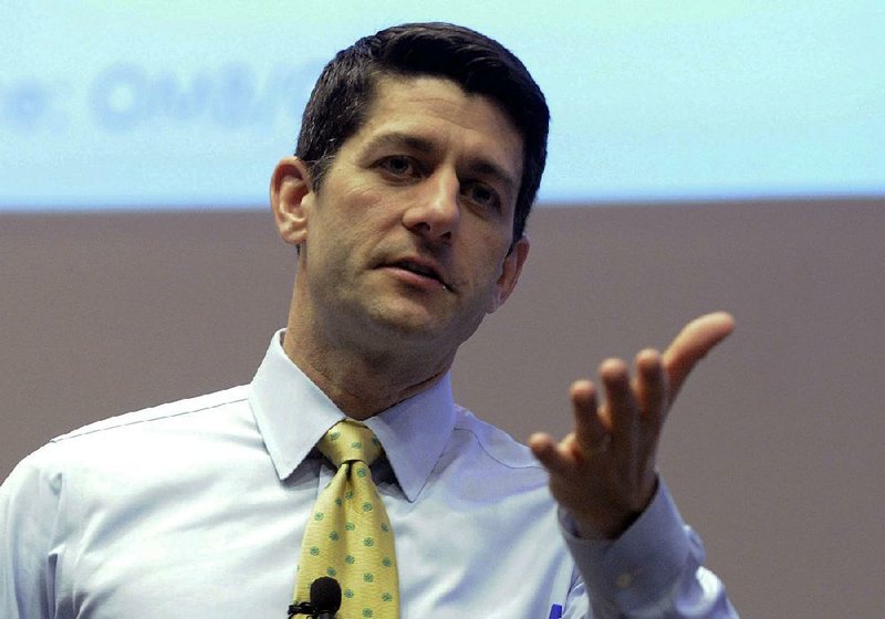 In this March 20, 2014 photo Republican Rep. Paul Ryan answers constituents questions during a listening session at the Snap-on Headquarters in Kenosha, Wis. 