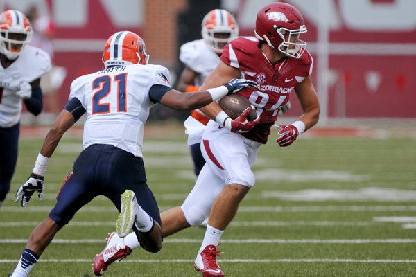 Arkansas tight end Hunter Henry breaks the tackle of UTEP free safety Dashone Smith on Saturday, Sept. 5, 2015, during the first quarter of the game in Razorback Stadium in Fayetteville.