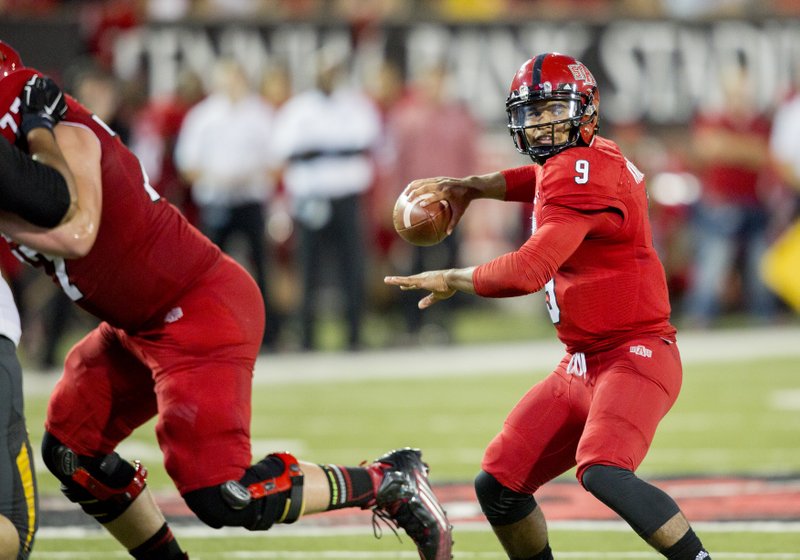 Arkansas State quarterback Fredi Knighten passes the ball into the end zone during an NCAA college football game, Saturday, Sept. 12, 2015, in Jonesboro.
