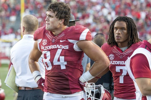 Arkansas junior tight end Hunter Henry (left) and sophomore wide receiver Damon Mitchell leave the field on Saturday, Sept. 12, 2015, following the Razorbacks' 16-12 loss to Toledo at War Memorial Stadium in Little Rock.