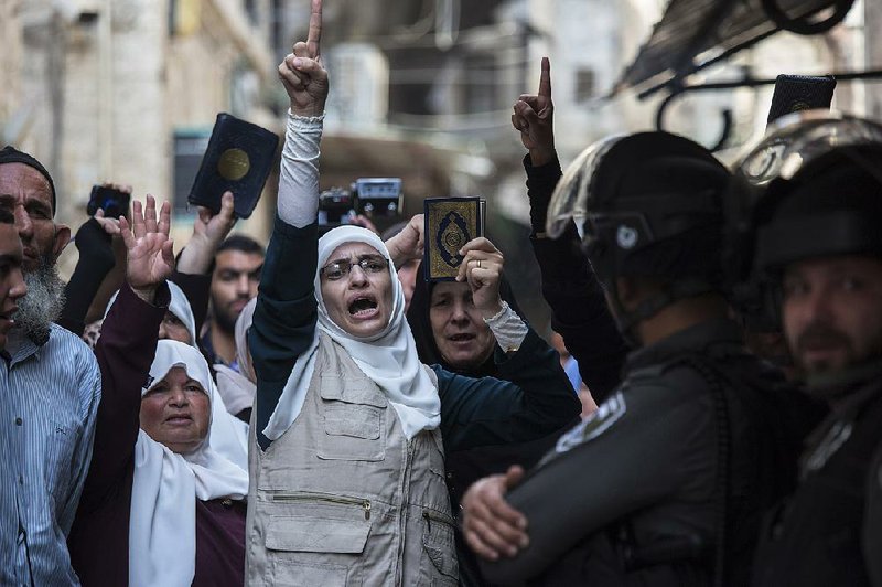 Palestinians rally during a protest in Jerusalem’s old city on Sunday. 