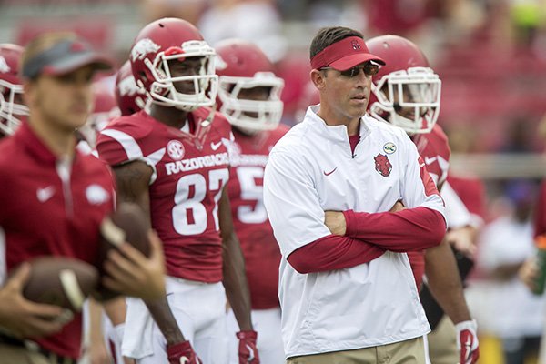 Arkansas offensive coordinator Dan Enos watches the team during warm-ups on Saturday, Sept. 5, 2015, before the Razorbacks' game against UTEP at Donald W. Reyonlds Razorback Stadium in Fayetteville.