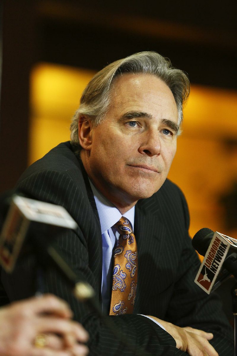 In this Dec. 15, 2013, file photo, University of Texas athletic director Steve Patterson discusses the search for a new head football coach during a news conference in Austin, Texas.  A person with direct knowledge of the decision says Texas athletic director Steve Patterson has been fired.