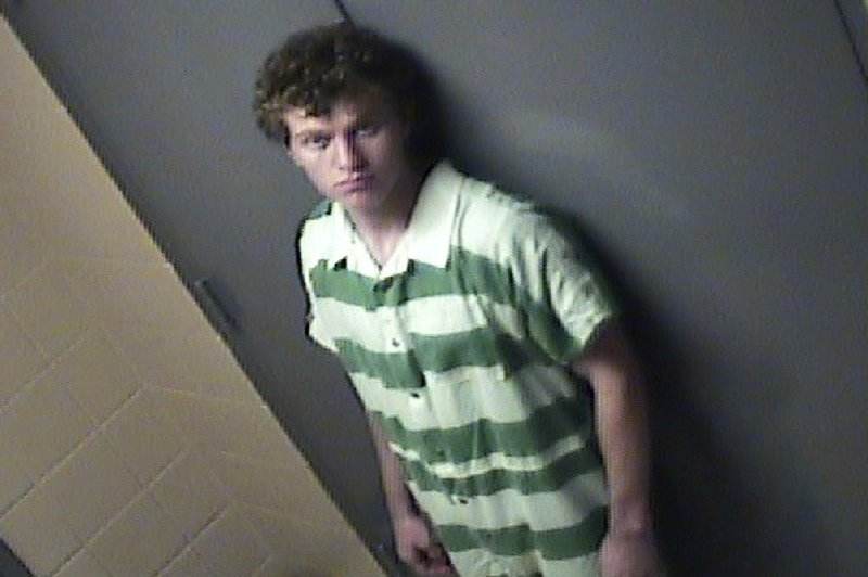 In this jail photo provided by Conway Ark., Police Department, suspect Hunter Drexler stands by a door Friday, Aug. 7, 2015, in Conway. 