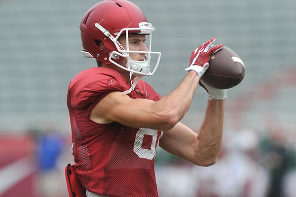 Arkansas receiver Cody Hollister makes a catch Saturday, Aug. 22, 2015, during practice at Razorback Stadium in Fayetteville.