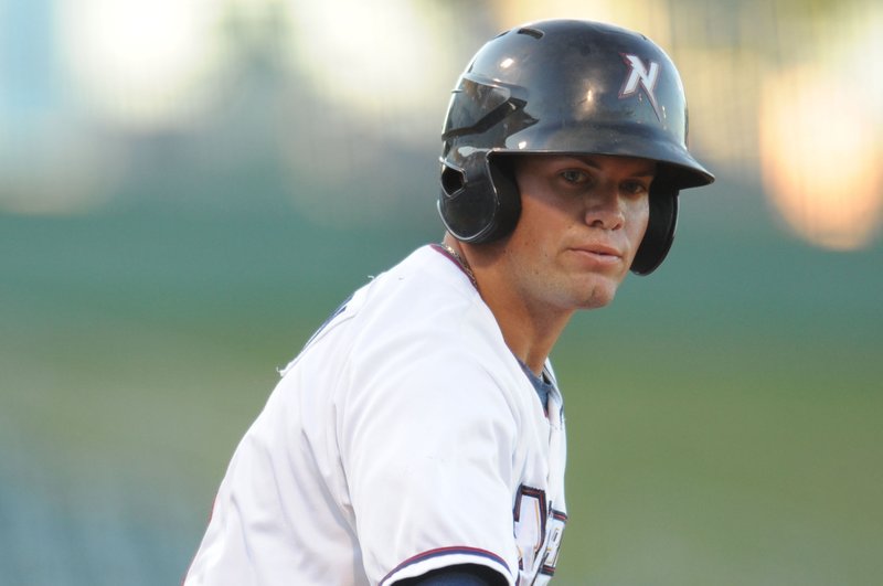 Parker Morin, Northwest Arkansas Naturals catcher, flips the bat away Aug. 12 after drawing a walk against San Antonio at Arvest Ballpark in Springdale.