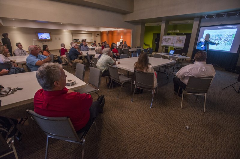 John Hoal with H3 Studio gives a presentation Friday about some of the ideas for downtown Springdale at the Arts Center of the Ozarks. The event finished a week of public design sessions for the downtown plan from residents.