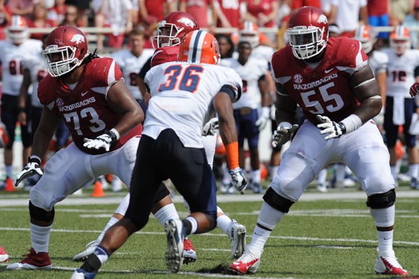 Arkansas' Denver Kirkland (55) and Sebastian Tretola block as University of Texas at El Paso's Nick Usher moves to the line of scrimmage Saturday, Sept. 5, 2015, during the second quarter of play in Razorback Stadium in Fayetteville.