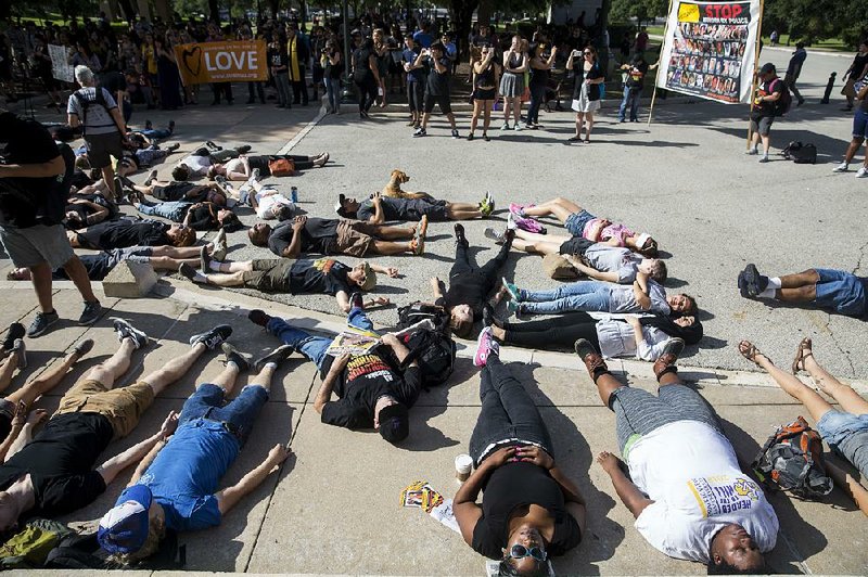 During a rally at the Texas Capitol, dozens of Black Lives Matter Austin protesters participate Saturday in a “die-in” to remember people killed by police this year. 
