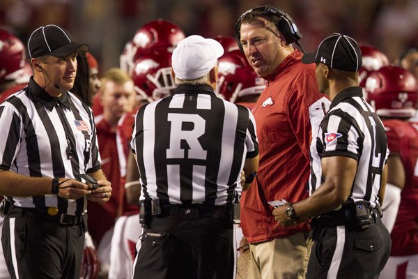 Arkansas coach Bret Bielema approaches the referees after a penalty that retracted a touchdown late in the fourth quarter after an interference call against the offense during their game against Texas Tech Saturday, Sept. 19, 2015, at Donald W. Reynolds Razorback Stadium in Fayetteville. 