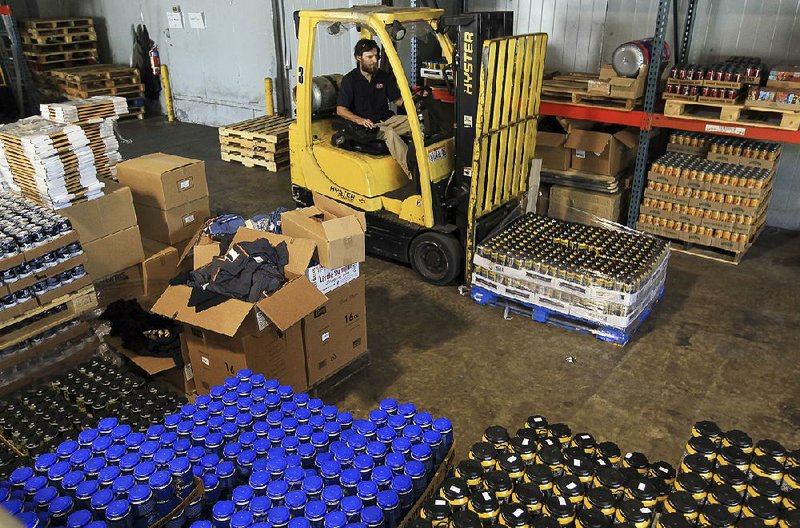 David Rice, a warehouse manager for Arkansas Craft Beer Distributors, prepares a pallet of beer from more than 20 craft breweries around the country for delivery to stores and bars around central Arkansas.