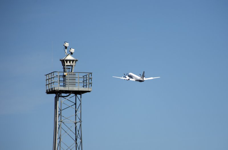 In this April 2015 photo provided by Saab AB, a plane takes off beyond a remotely controlled control tower at Ornskoldsvik Airport in northern Sweden. 