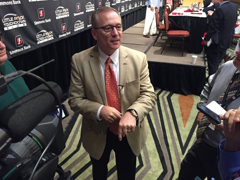 University of Arkansas Athletic Director Jeff Long addresses media questions after his speech at the Little Rock Touchdown Club on Monday, Sept. 21, 2015.